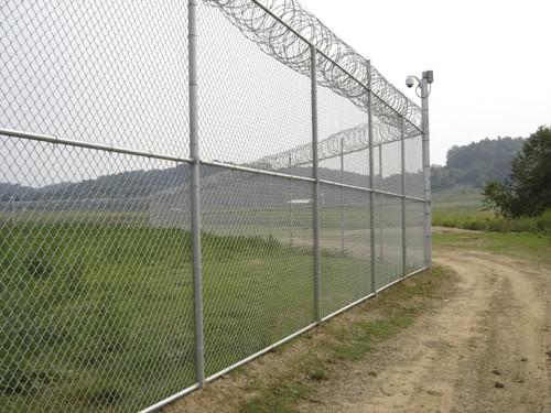 Industrial security chain link with barbed wire Dallas TX