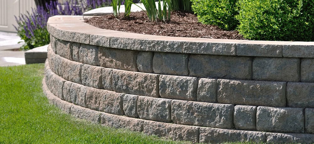 Limestone retaining wall for soil stabilization Frisco TX