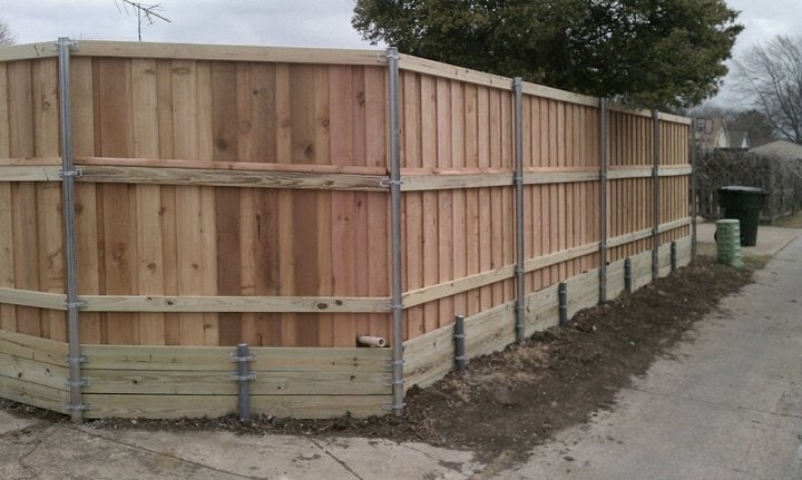 Cedar privacy fence over retaining wall Plano TX