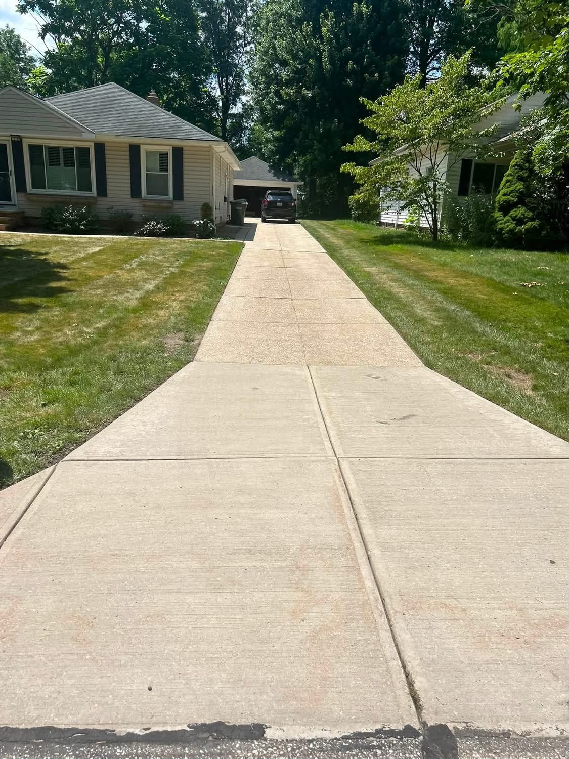 Clean driveway after power washing