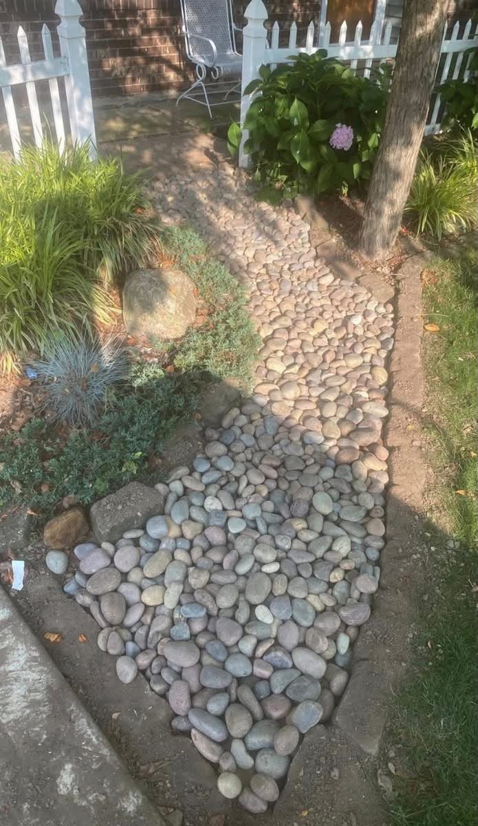 Outdoor landscaping and stone pathway improvement