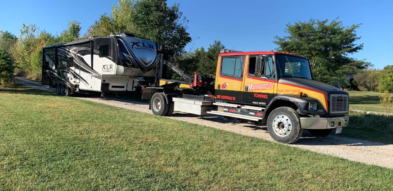 Maynard's recovery truck moving a large RV trailer