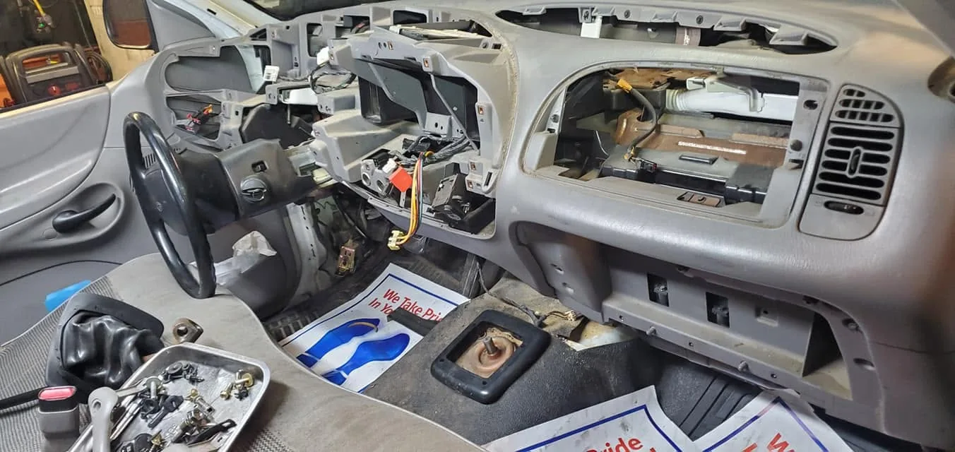 Vehicle dashboard disassembled for electrical repair